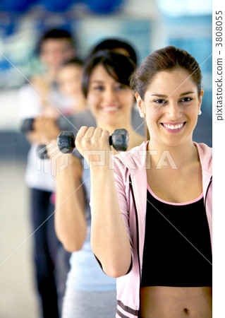 Woman with free weights 3808055