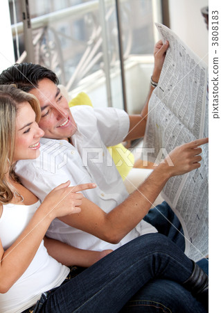 Couple with the newspaper Couple with the newspaper 3808183