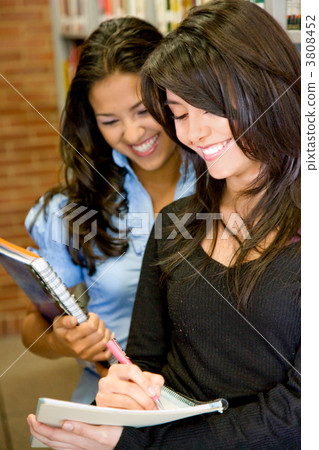 students in a library students in a library 3808452