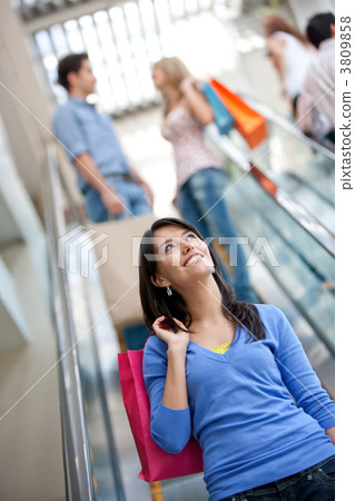 Shopping woman on scalators Shopping woman on scalators 3809858
