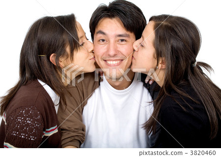 twins kissing a man 3820460