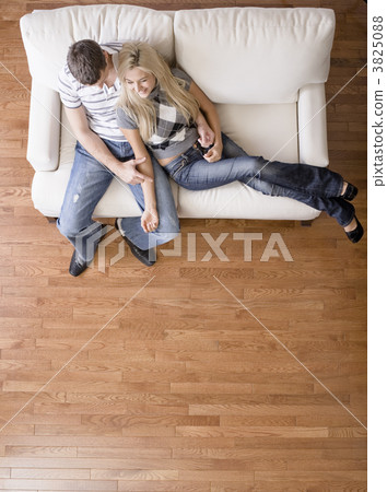 Overhead View of Couple on Love Seat Overhead View of Couple on Love Seat 3825088