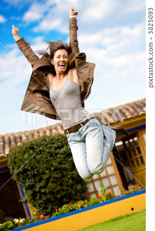 happy girl jumping and smiling happy girl jumping and smiling 3825093
