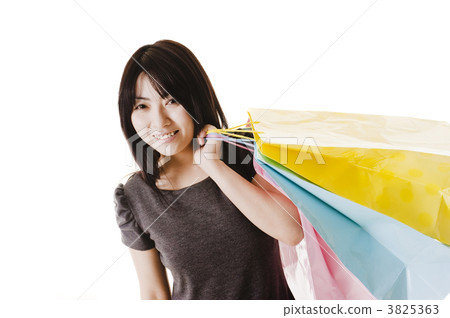 Chinese woman holding shopping bags. 3825363