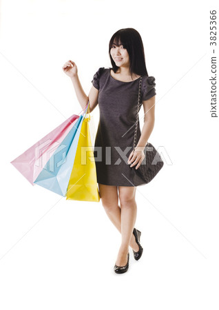 Chinese woman holding shopping bags. 3825366