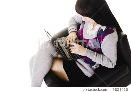 Chinese student working on a laptop. 3825410
