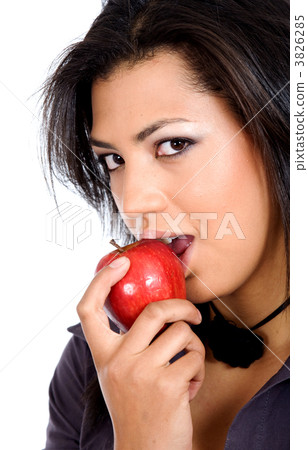 african girl biting an apple african girl biting an apple 3826285
