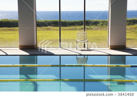 Indoor swimming pool with glass facing the sea 3841488