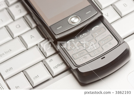 Cell Phone on Laptop Macro 3862193