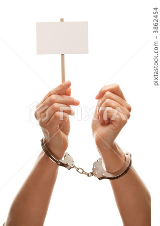 Handcuffed Woman Holding Blank White Sign Isolated on White Handcuffed Woman Holding Blank White Sign Isolated on White 3862454
