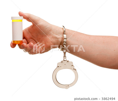 Handcuffed Man Holding Blank Medicine Bottle Isolated on White 3862494