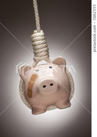 Piggy Bank with Bandage Hanging in Hangman's Noose 3862555