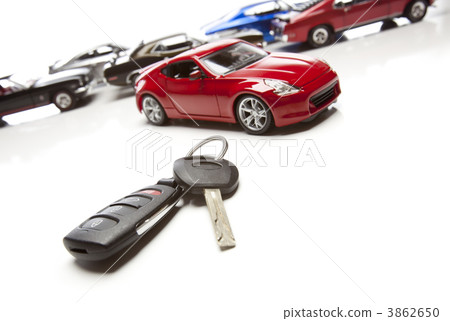 Car Keys and Several Sports Cars on White 3862650