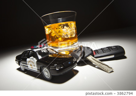 Highway Patrol Police Car Next to Alcoholic Drink and Keys Highway Patrol Police Car Next to Alcoholic Drink and Keys 3862794