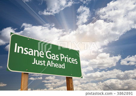 Insane Gas Prices Green Road Sign and Clouds Insane Gas Prices Green Road Sign and Clouds 3862891