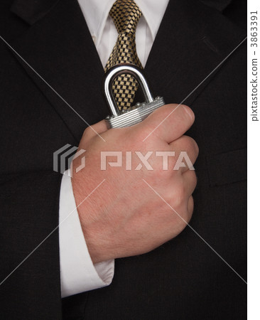 Businessman Holding Large Lock Businessman Holding Large Lock 3863391