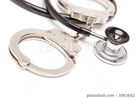 Stethoscope and Handcuffs on White 3863682
