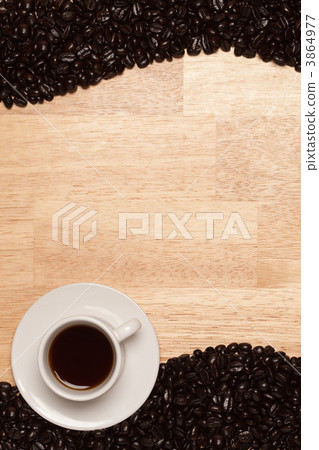 Dark Roasted Coffee Beans on Wood Background Dark Roasted Coffee Beans on Wood Background 3864977