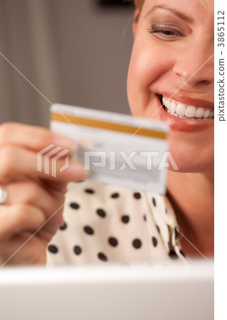 Beautiful Woman Using Laptop Holding Her Credit Card 3865112