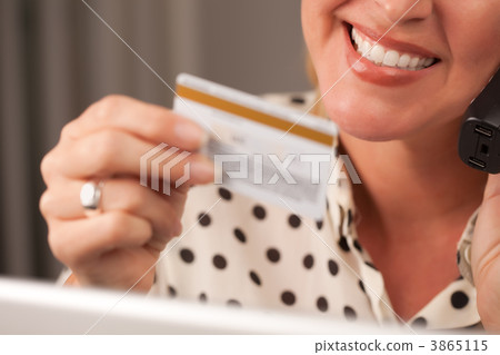 Beautiful Woman on Phone Holding Credit Card 3865115