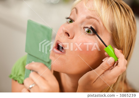 Blonde Woman Applying Her Mascara 3865239