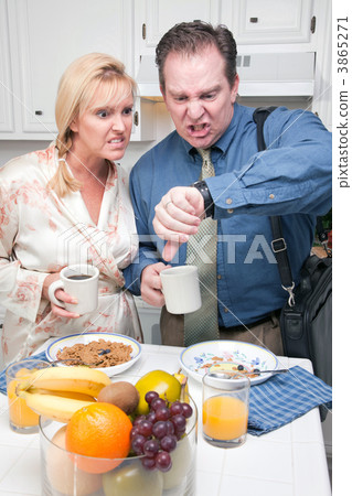 Stressed Couple in Kitchen Late for Work Stressed Couple in Kitchen Late for Work 3865271