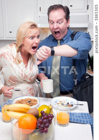 Stressed Couple in Kitchen Late for Work Stressed Couple in Kitchen Late for Work 3865305