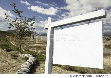 Blank Real Estate Sign and Empty Construction Lots 3865554