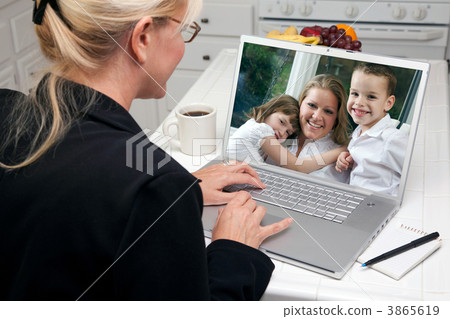 Woman In Kitchen Using Laptop - Family and Friends 3865619
