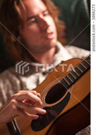Young Musician Plays His Acoustic Guitar Young Musician Plays His Acoustic Guitar 3866273