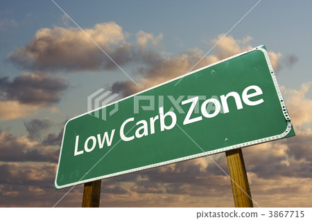 Low Carb Zone Green Road Sign and Clouds Low Carb Zone Green Road Sign and Clouds 3867715