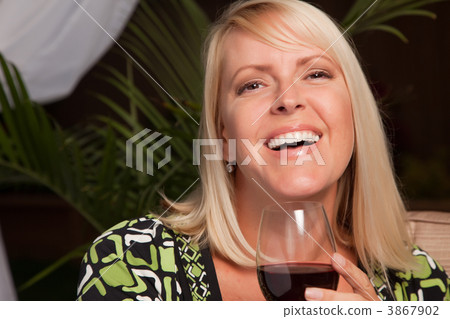 Beautiful Blonde Woman Enjoying Wine Beautiful Blonde Woman Enjoying Wine 3867902