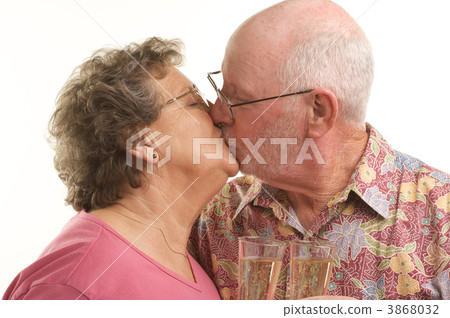 Happy Senior Couple Kissing 3868032