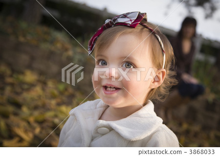 Adorable Baby Girl Playing in Park with Mom Adorable Baby Girl Playing in Park with Mom 3868033