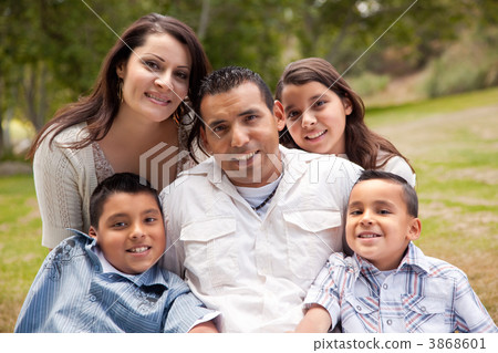 Happy Hispanic Family In the Park 3868601