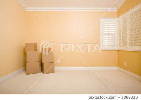 Moving Boxes in Empty Room with Copy Space on Wall 3869320