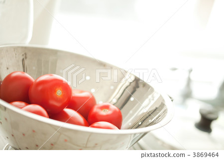 Fresh, Vibrant Roma Tomatoes in Colander with Water Drops 3869464