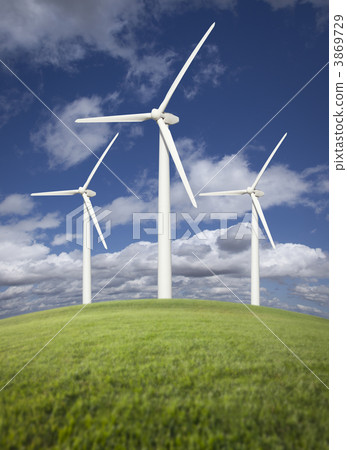 Wind Turbines Over Grass Field, Dramatic Sky and Clouds Wind Turbines Over Grass Field, Dramatic Sky and Clouds 3869729