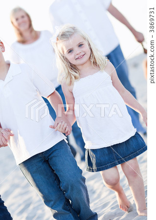 Adorable Little Girl Walking With Her Family Adorable Little Girl Walking With Her Family 3869731