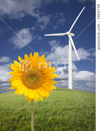 Wind Turbine Against Dramatic Sky with Bright Sunflower Wind Turbine Against Dramatic Sky with Bright Sunflower 3869738