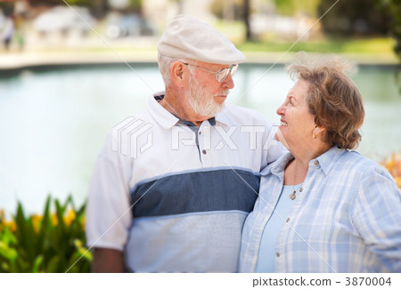 Happy Senior Couple in The Park Happy Senior Couple in The Park 3870004