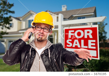 Contractor in Hard Hat in Front of House and Sign 3870195