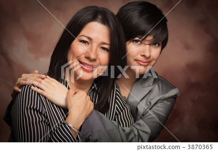 Attractive Multiethnic Mother and Daughter Studio Portrait 3870365