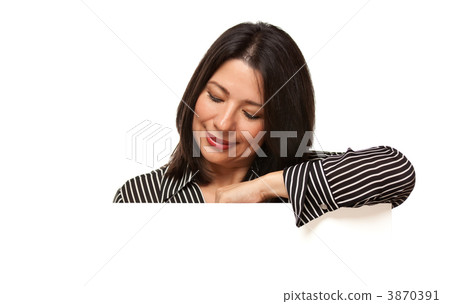 Attractive Multiethnic Woman Looking Down to Blank White Sign 3870391