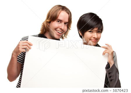 Attractive Diverse Couple Holding Blank White Sign 3870423