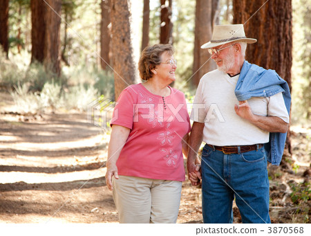 Loving Senior Couple Walking Together Loving Senior Couple Walking Together 3870568