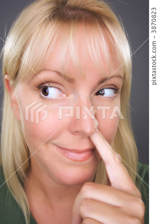 Blond Woman with Finger in Her Nose 3870823