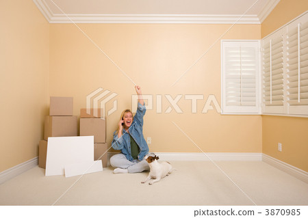 Excited Woman on Phone Near Boxes and Blank Signs 3870985