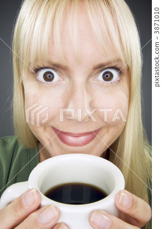 Beautiful Woman Enjoys Coffee Beautiful Woman Enjoys Coffee 3871010