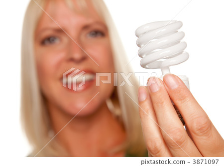 Attractive Blonde Woman Holds Energy Saving Light Bulb Attractive Blonde Woman Holds Energy Saving Light Bulb 3871097